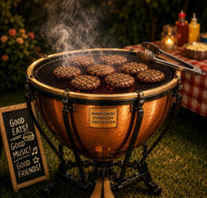 A timpani that has been modified to look like a charcoal grill with burgers cooking on top and a picnic background.