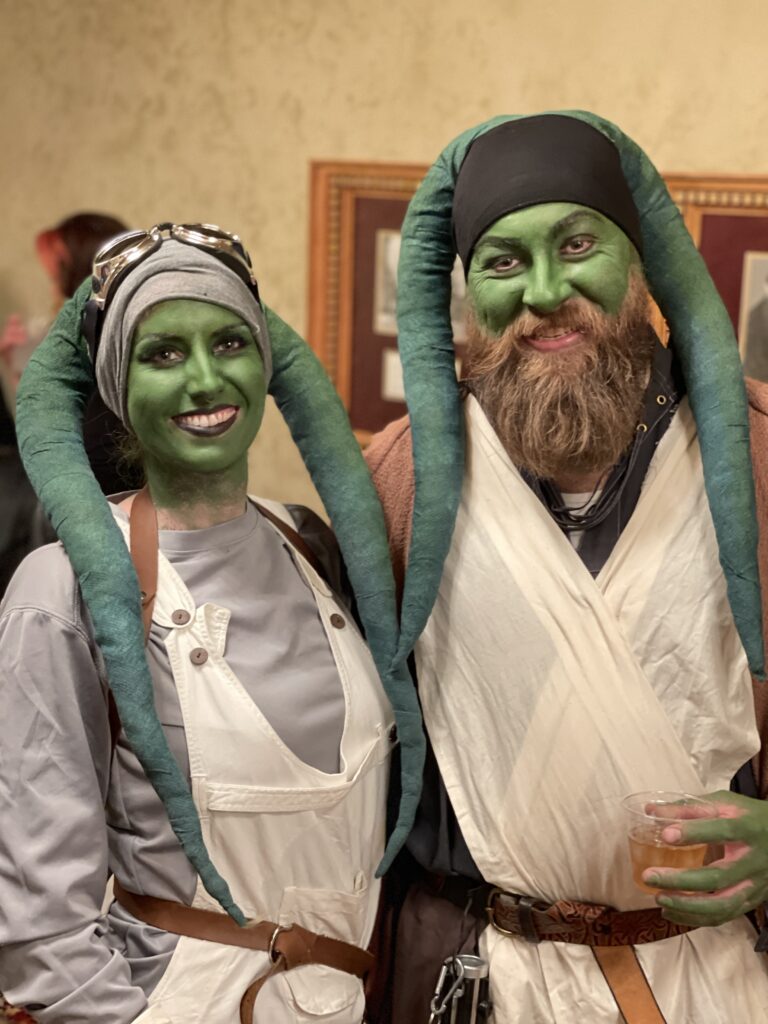 A man and woman dressed as star wars characters